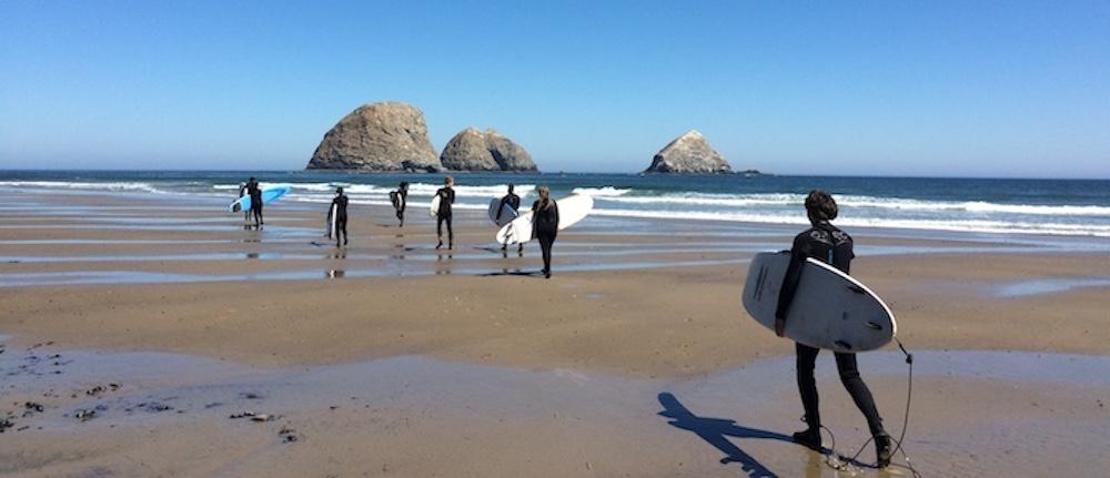 students surfing on the Oregon Coast